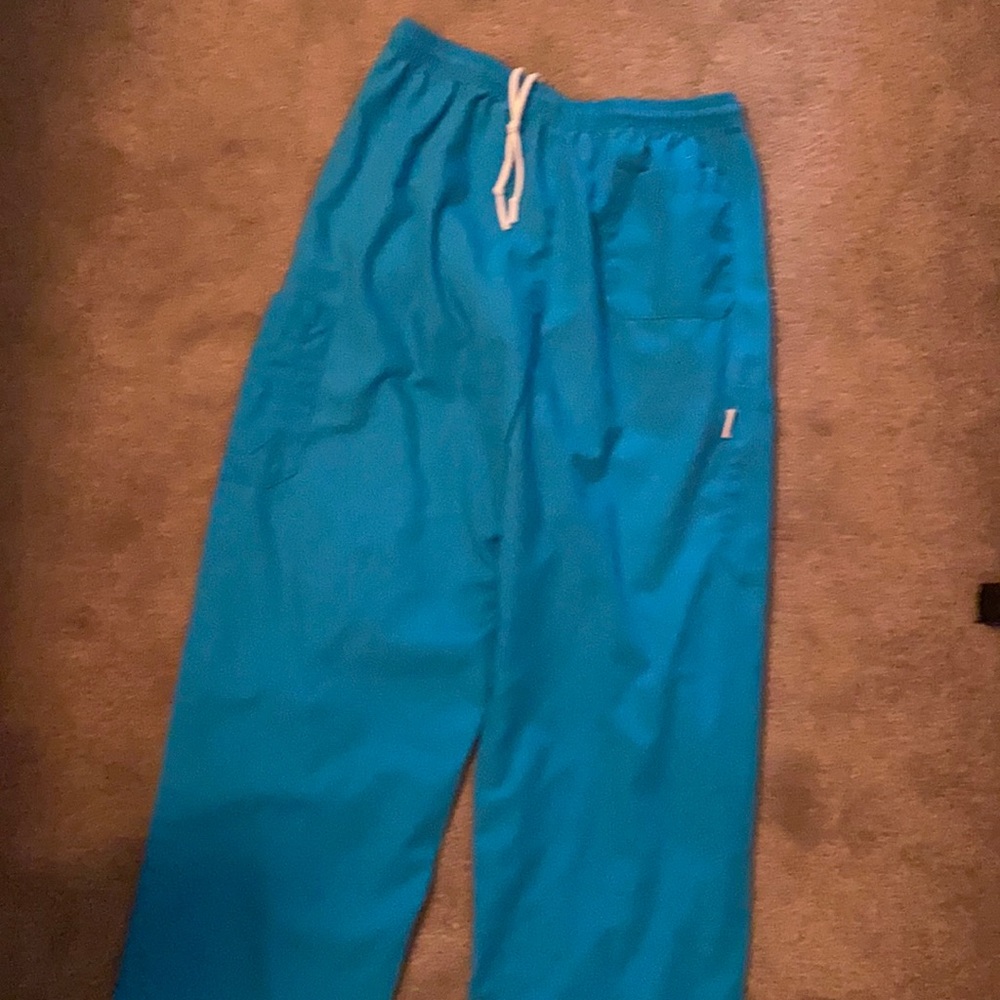 2 Original Keiser university used scrub pants. I believe they are teal in color.